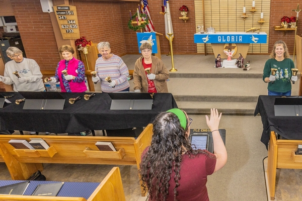 People holding handbells